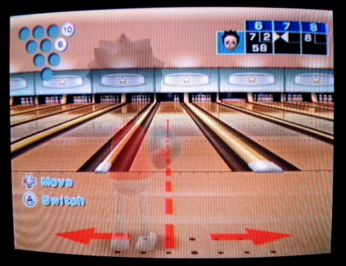 This is Wii Bowling. The game says to twist your hand to curve the ball. I was rather impressed that the ball would tend to spin left, just like real life.